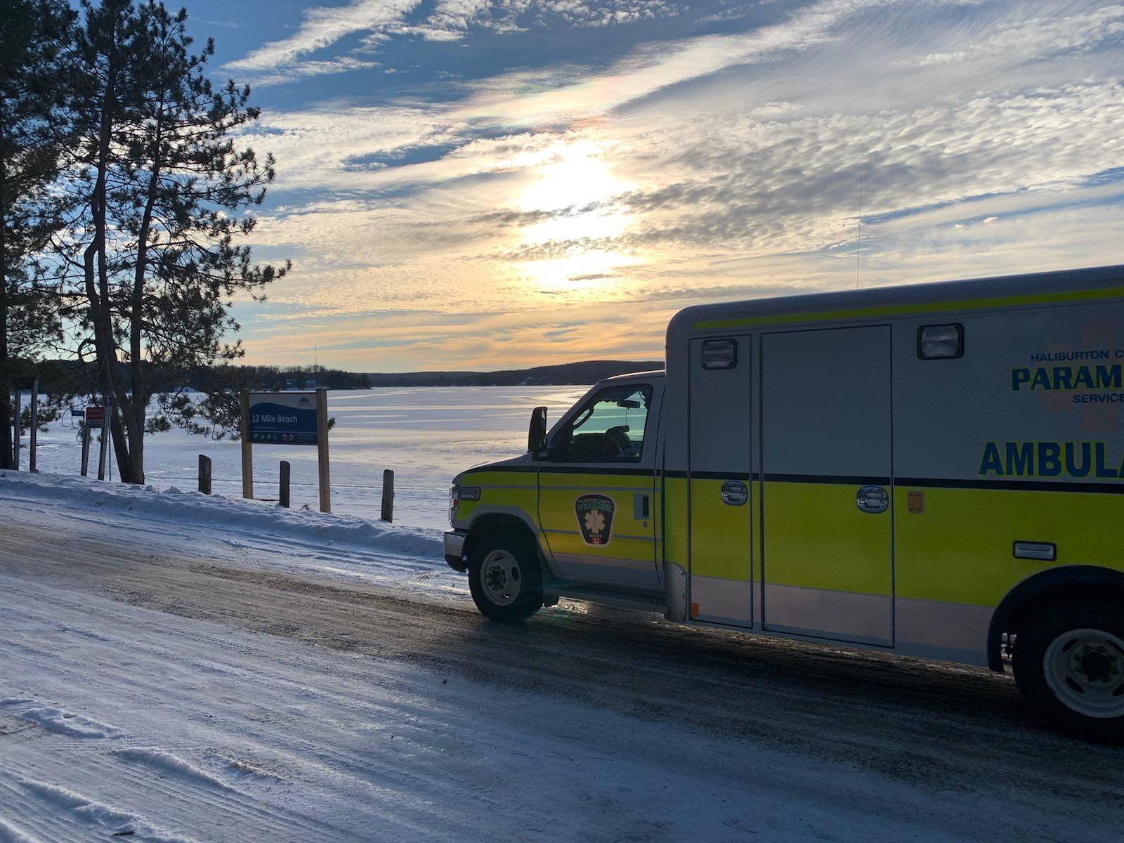 Ambulance in front of the lake in winter