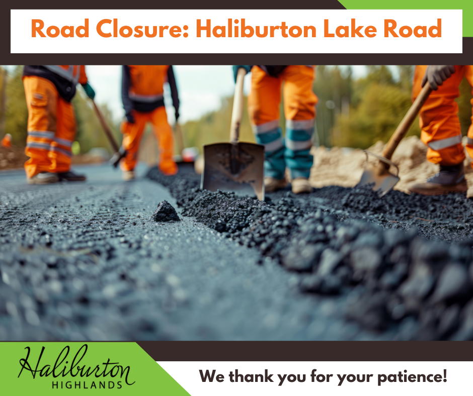 a close up photo of road construction and a workers shovel