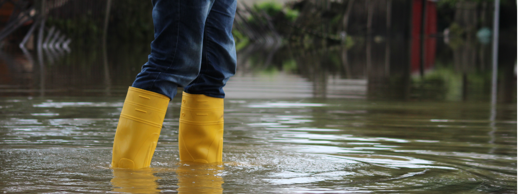 somebody walking on a flooded area