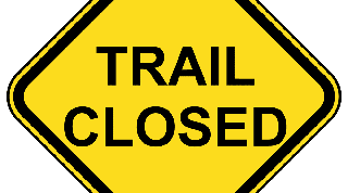 Yellow trail closed warning sign.